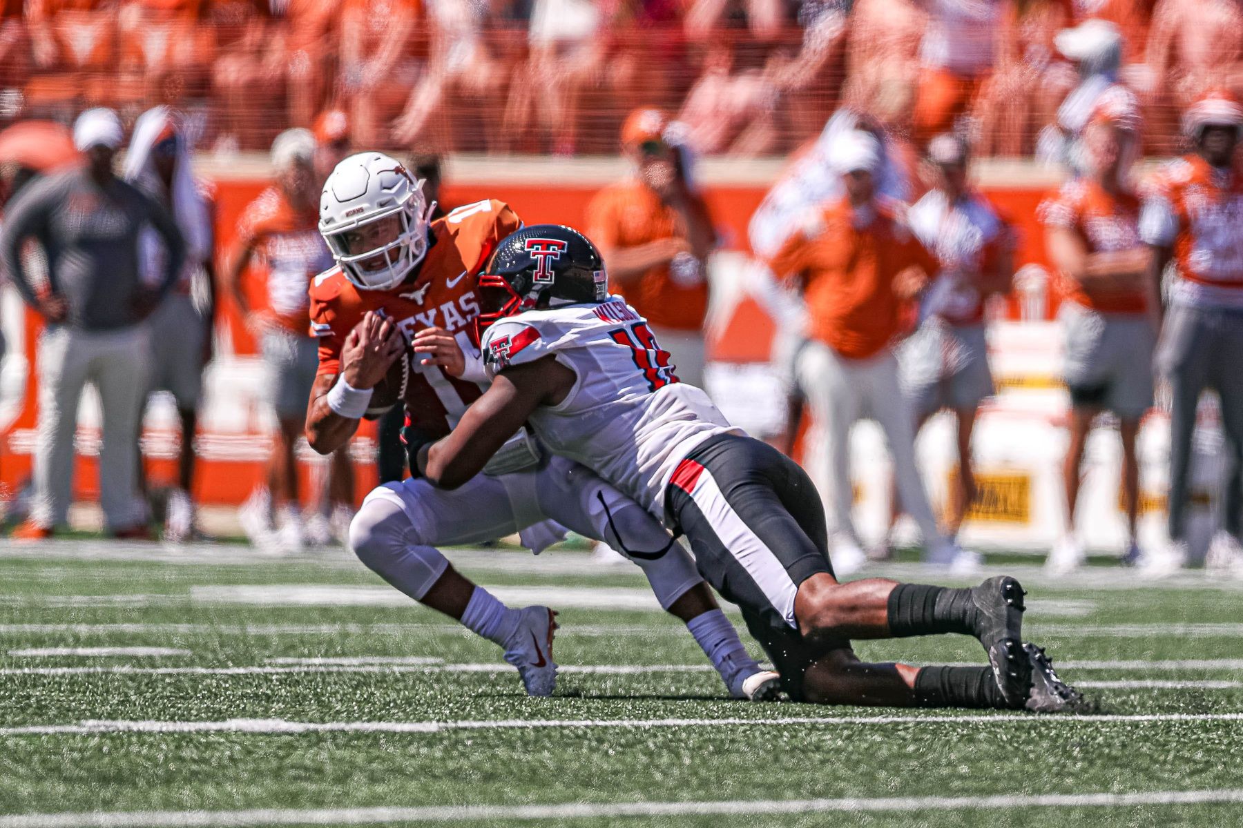 Texas quarterback Casey Thompson (11) is sacked by Texas Tech defensive lineman Tyree Wilson (19).