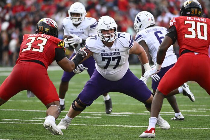 Northwestern OL Peter Skoronski (77) in his stance to block against Maryland's defense.