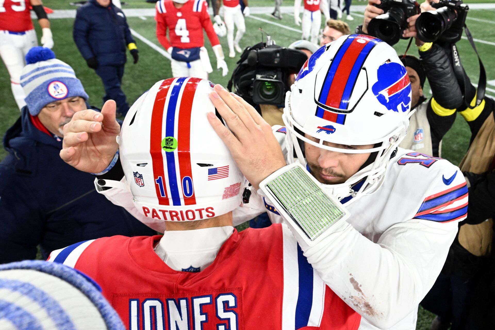 Josh Allen (17) meets New England Patriots quarterback Mac Jones (10) after a game at Gillette Stadium.