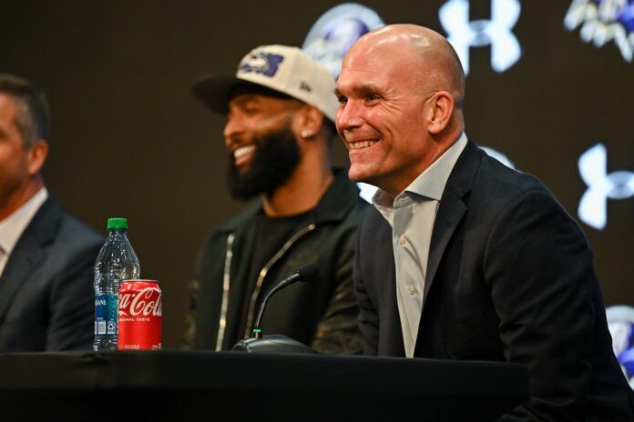 Baltimore Ravens GM Eric DeCosta and WR Odell Beckham Jr. smile during a press conference.