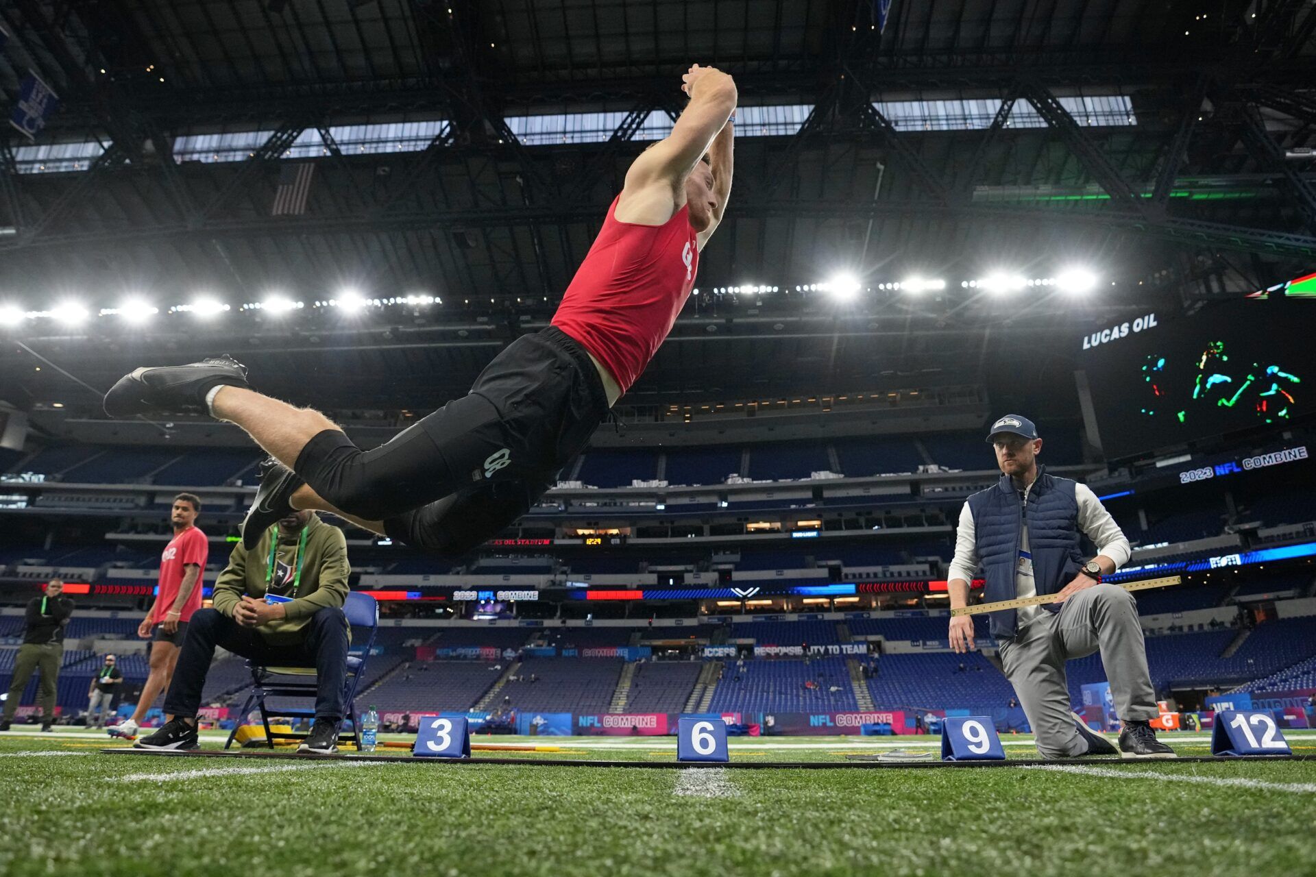 Kentucky quarterback Will Levis (QB08) participates in the broad jump at Lucas Oil Stadium