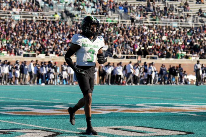 Marshall Thundering Herd defensive back Steven Gilmore (3) runs from the field after a play against the Connecticut Huskies.