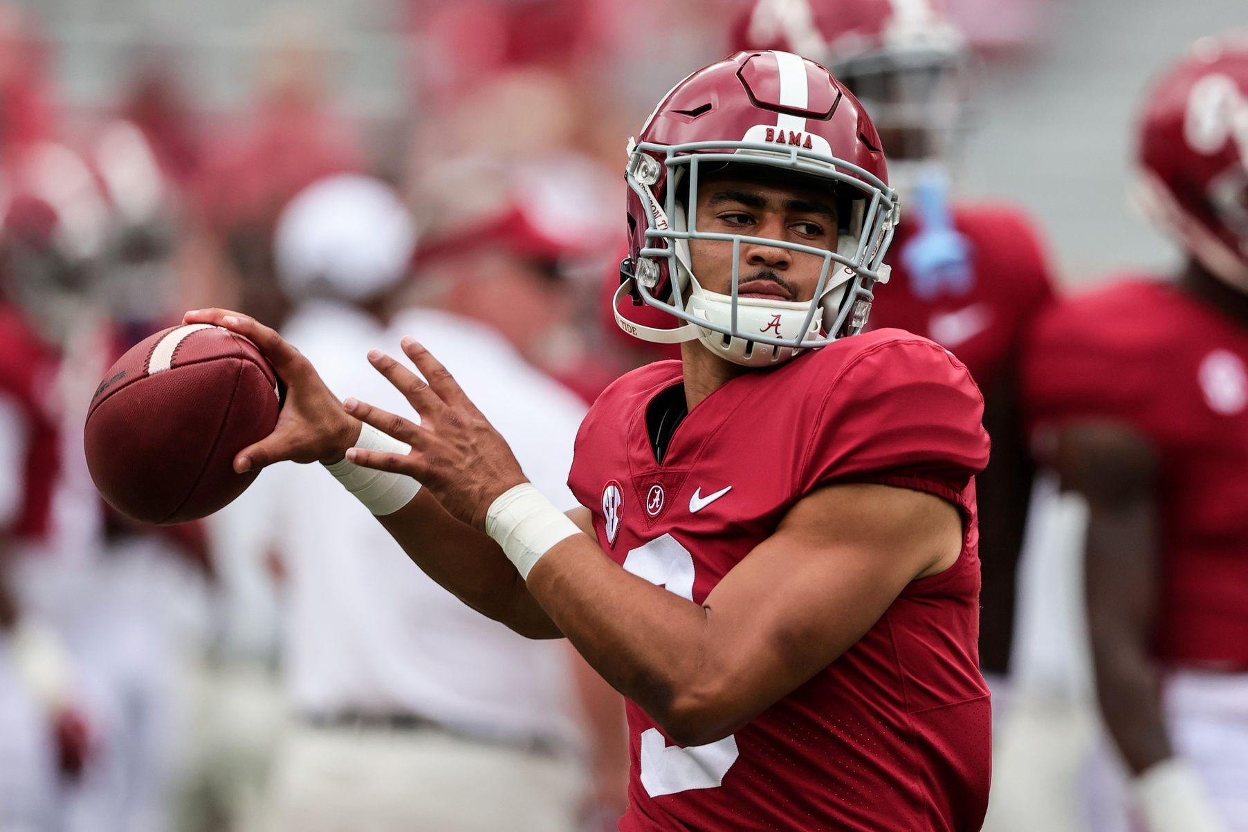 Bryce Young (9) warms up before the start of an NCAA college football game.