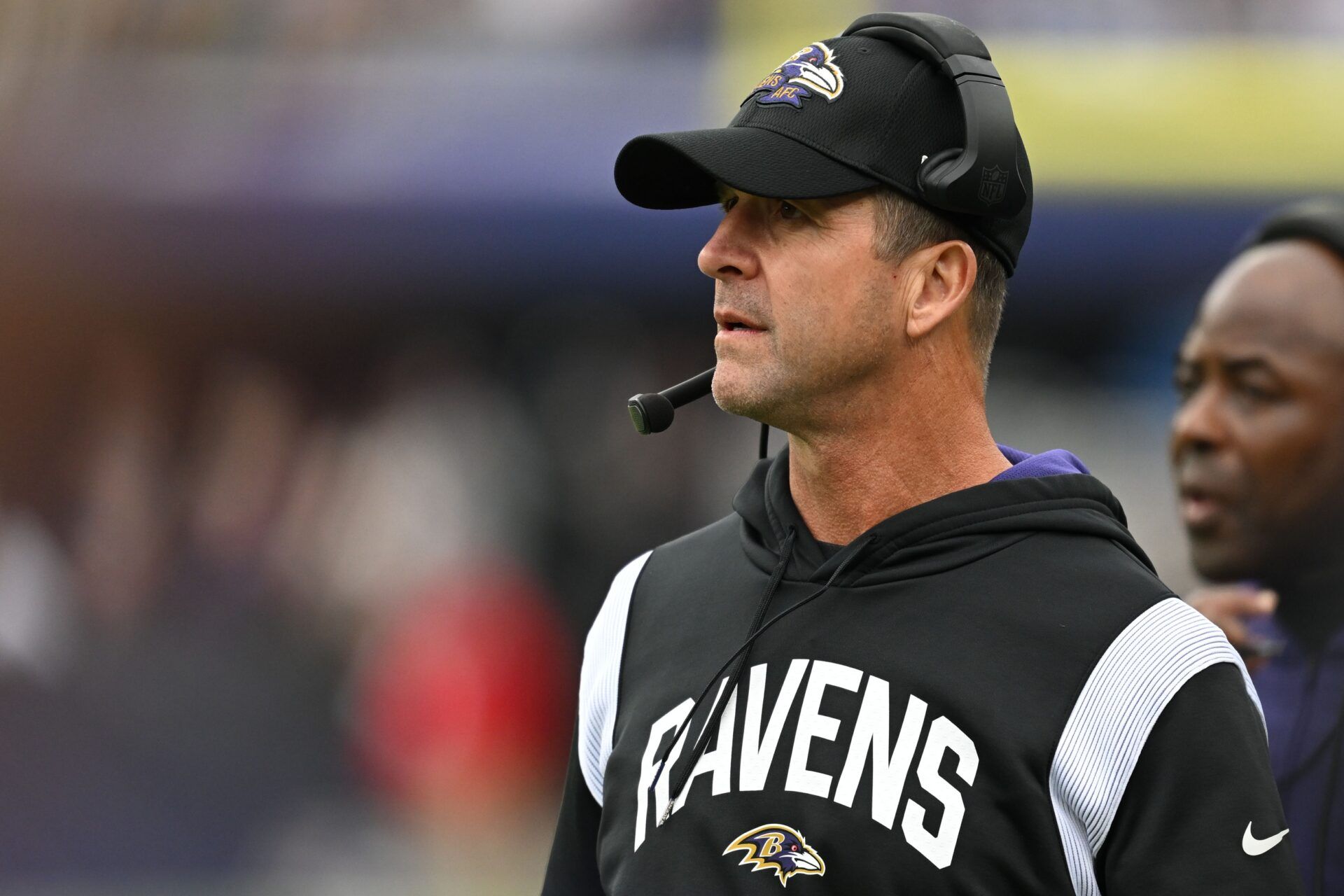 John Harbaugh stands on the sidelines during the second half against the Cleveland Browns.