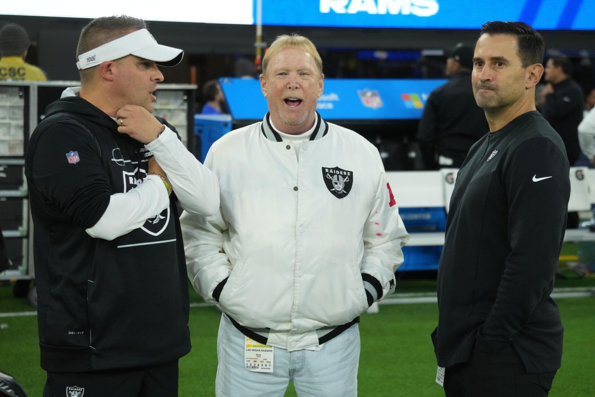 Las Vegas Raiders coach Josh McDaniels (left), owner Mark Davis (center) and general manager Dave Ziegler talk before the game against the Los Angeles Rams.