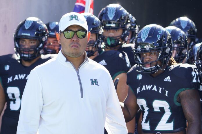 Hawaii Warriors head coach Timmy Chang waits to take the field.