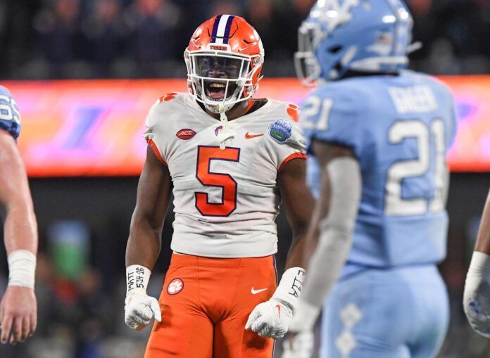 K.J. Henry (5) celebrates a defensive play near North Carolina defensive back Dontavius Nash (21).