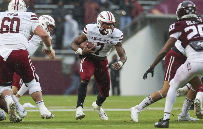 Massachusetts Minutemen running back Ellis Merriweather (7) runs with the ball during the first quarter against the Texas A&M Aggies at Kyle Field.