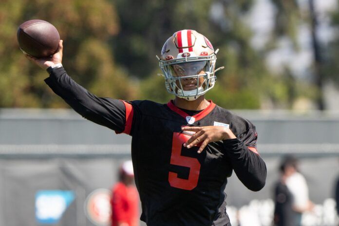 San Francisco 49ers QB Trey Lance (5) throws a pass during practice.