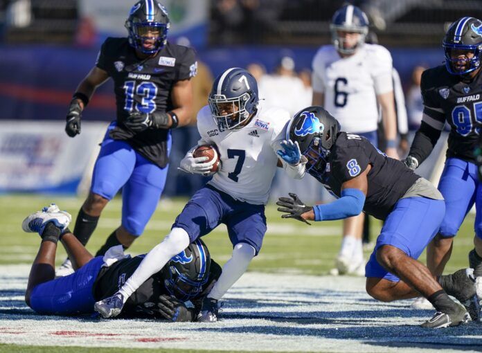 Georgia Southern Eagles wide receiver Khaleb Hood (7) is tackled by Buffalo Bulls defensive end C.J. Bazile (53) and linebacker James Patterson (8) during the first half in the 2022 Camellia Bowl at Cramton Bowl.