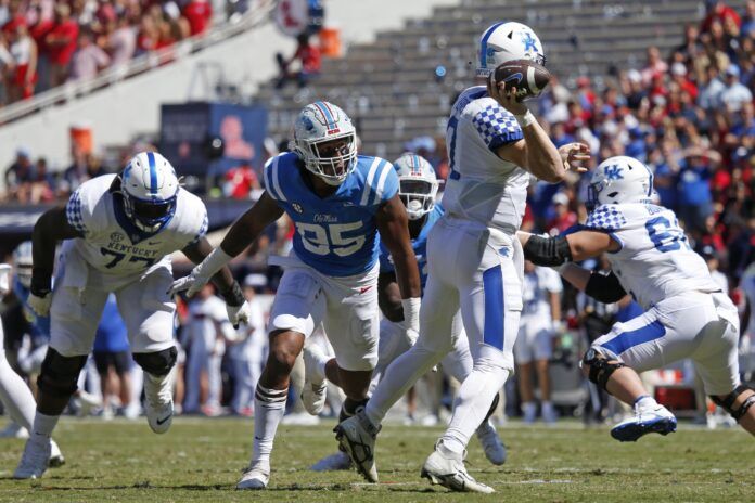 Mississippi Rebels defensive end Tavius Robinson (95) gets into the backfield to hurry Kentucky Wildcats quarterback Will Levis (7) during the first half at Vaught-Hemingway Stadium.