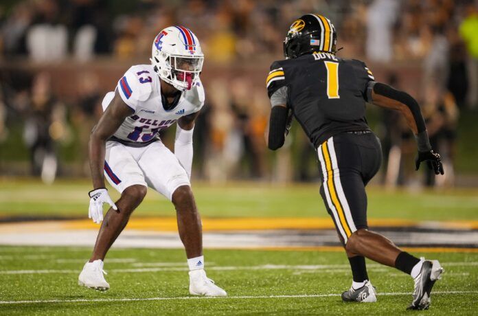 Myles Brooks (13) defends against Missouri Tigers wide receiver Tauskie Dove.