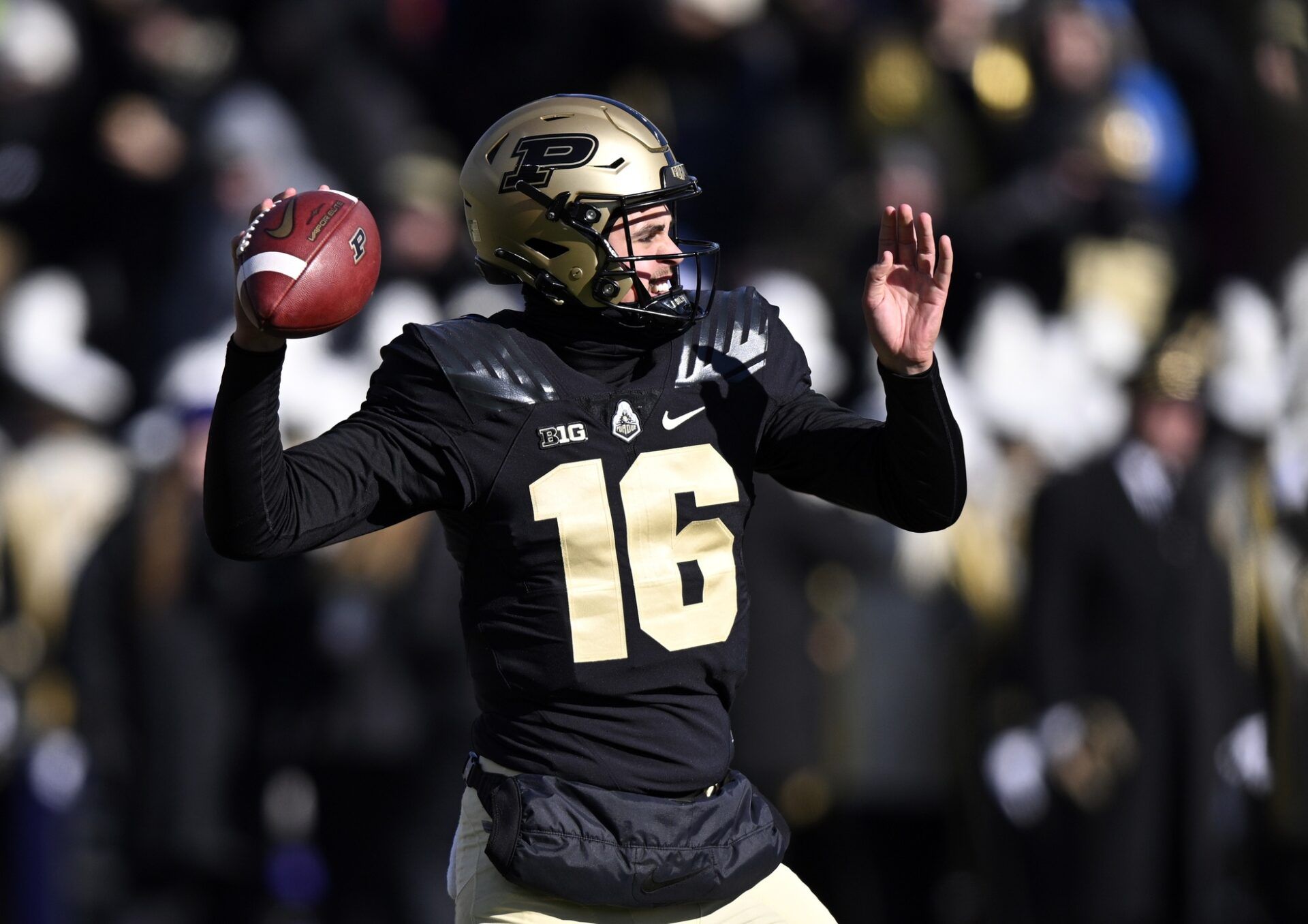 Aidan O'Connell (16) throws a ball during warm ups before the game against the Northwestern Wildcats.