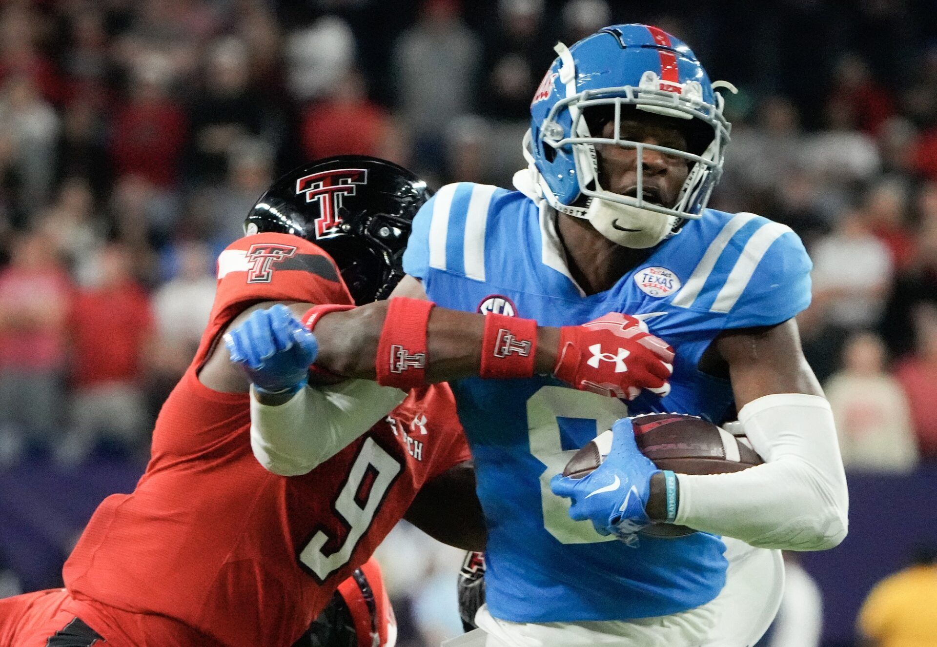 Ole Miss WR Malik Heath (8) attempts to break a tackle against Texas Tech.