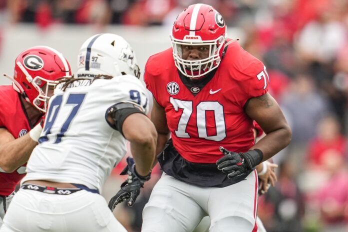 Warren McClendon (70) blocks against the Samford Bulldogs.