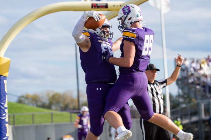 Thomas Greaney (89) celebrating with a teammate after a touchdown.