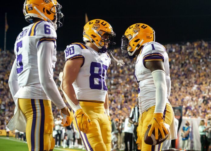 Kayshon Boutte (No. 1) reacts after scoring a touchdown.