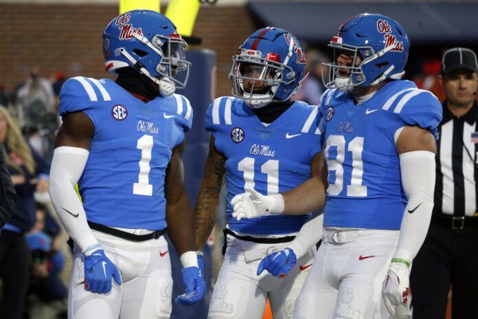 Jonathan Mingo (1) reacts with wide receiver Jordan Watkins (11) and tight end Casey Kelly (81) after a touchdown during the second half against the Alabama Crimson Tide.