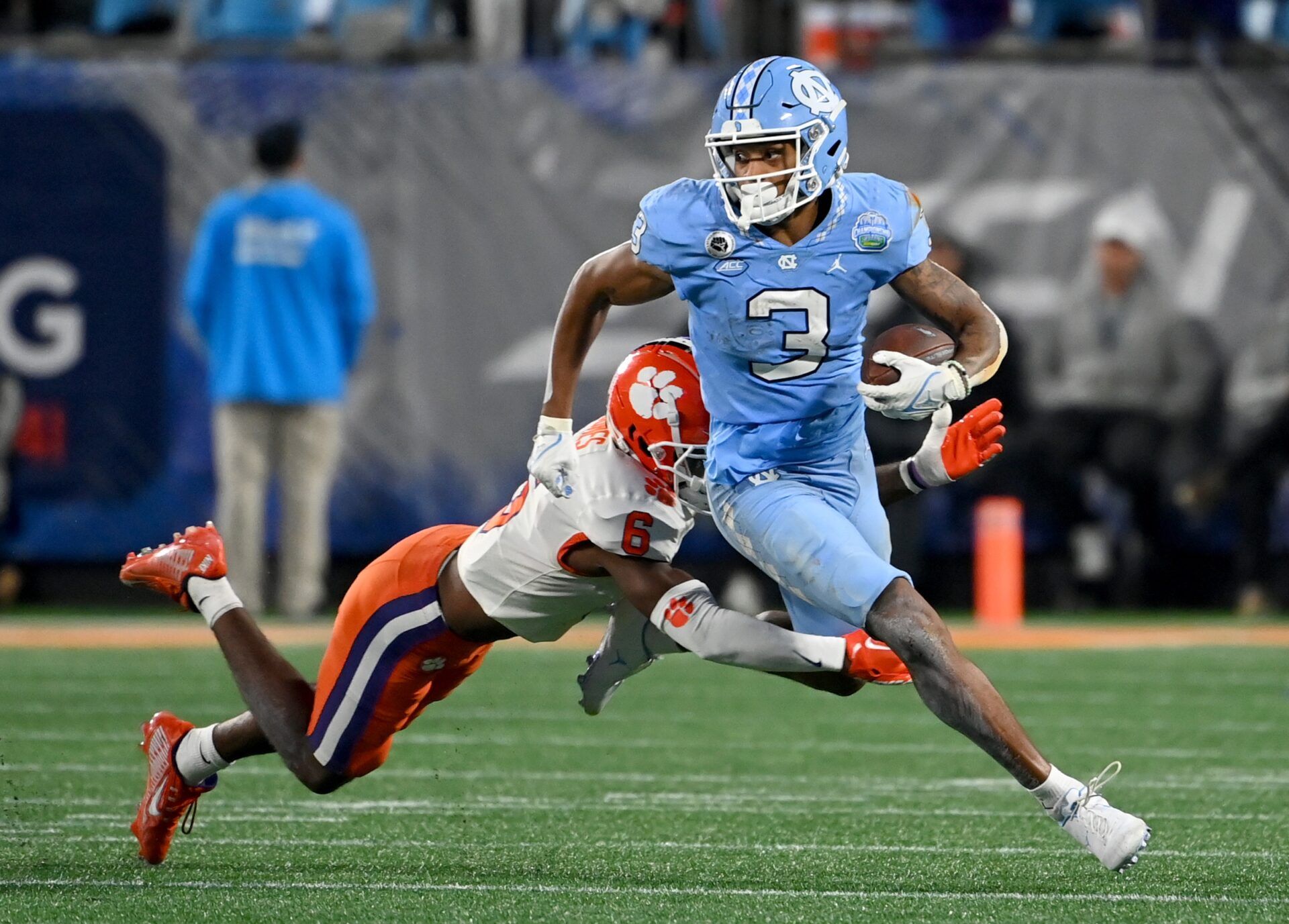 Antoine Green (3) is tackled by Clemson Tigers cornerback Sheridan Jones (6).
