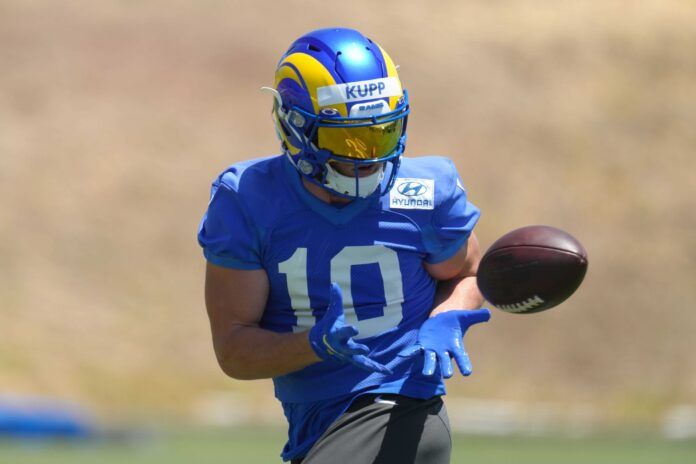 Cooper Kupp (10) catches the ball during organized team activities.