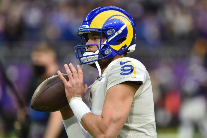 Matthew Stafford (9) warms up before the game against the Minnesota Vikings.