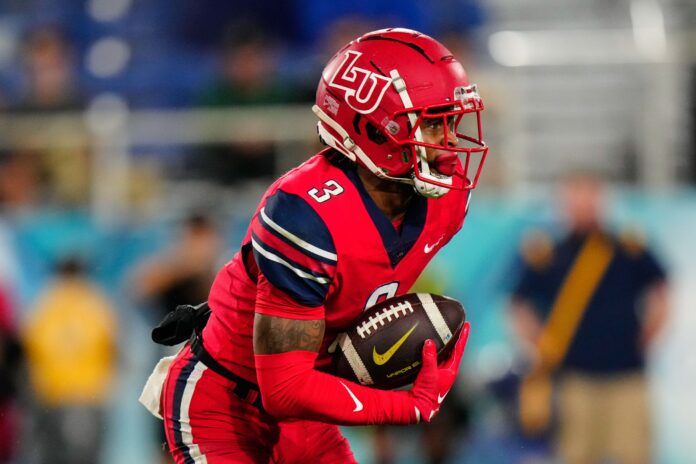 Demario Douglas (3) runs the ball against the Toledo Rockets.