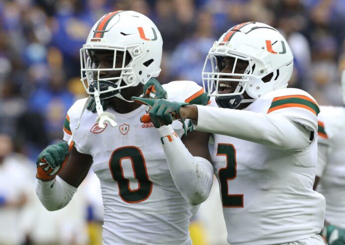 Miami Hurricanes safety James Williams (0) reacts with cornerback Tyrique Stevenson (2).