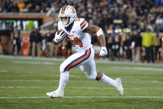 Syracuse Orange running back Sean Tucker (34) runs around end towards the end zone.