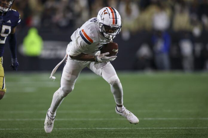 Virginia Cavaliers wide receiver Dontayvion Wicks (3) catches a pass.