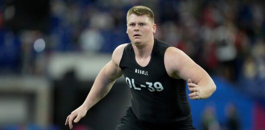 Minnesota OL John Michael Schmitz performs drills during the NFL Scouting Combine.