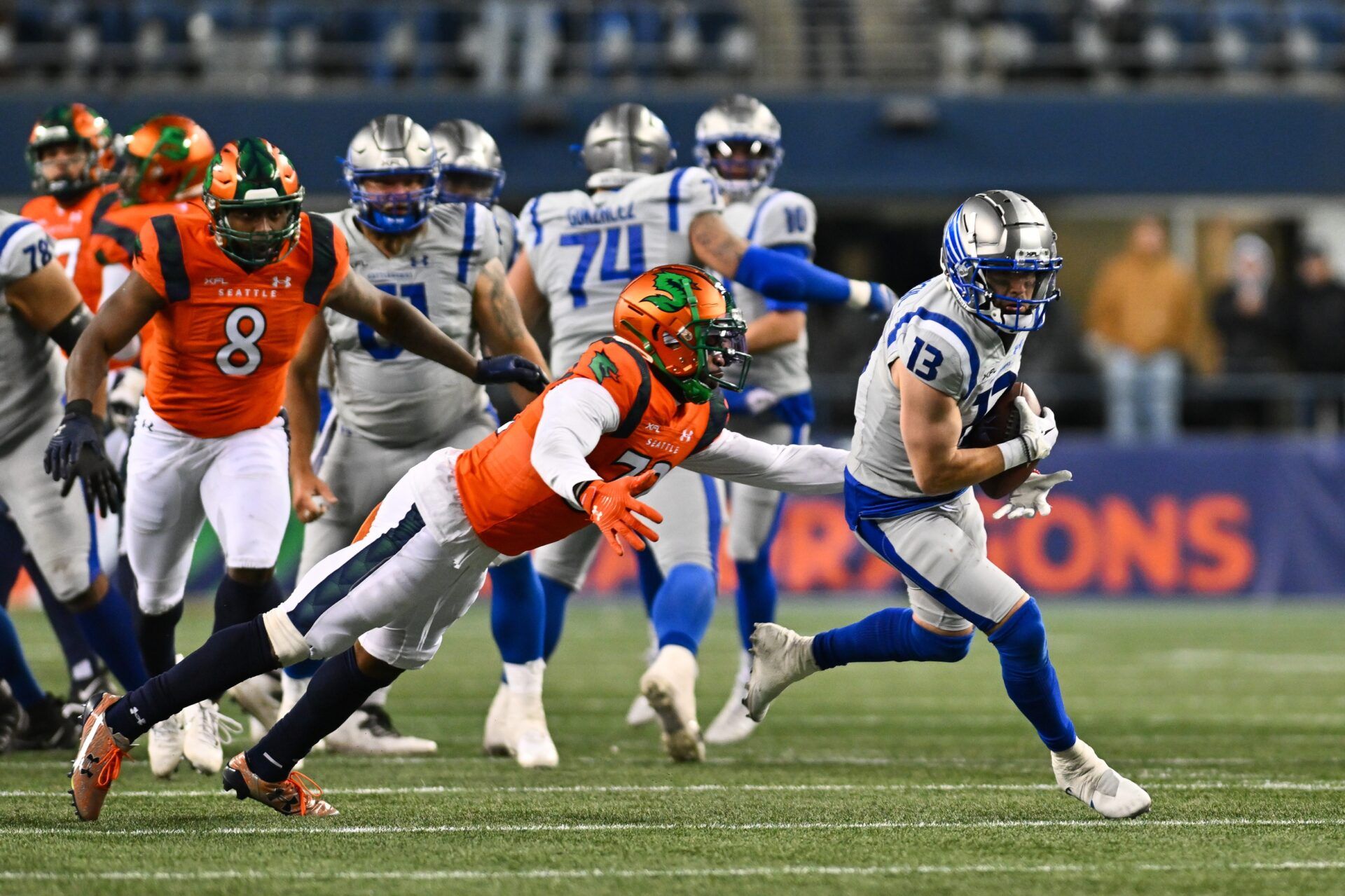 Seattle Sea Dragons cornerback Qwynnterrio Cole (32) tries to tackle St. Louis' Austin Proehl (13).