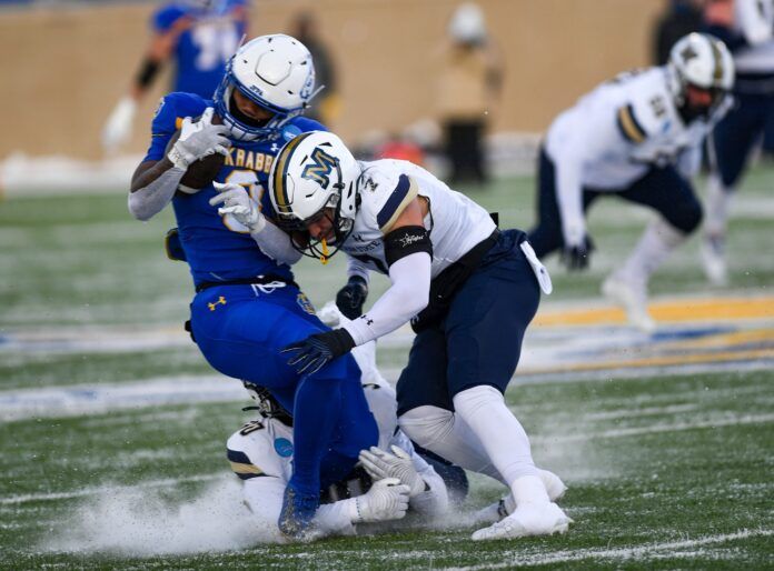 South Dakota State’s Amar Johnson is tackled by Montana State’s Ty Okada in the FCS semifinals.