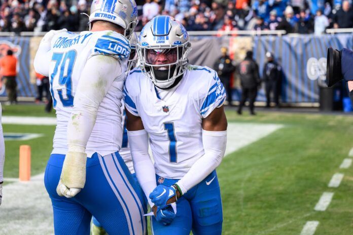 Jeff Okudah celebrates his interception for a touchdown in the fourth quarter against the Chicago Bears.