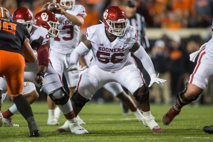 Chris Murray blocks during the first quarter agains the Oklahoma State Cowboys.