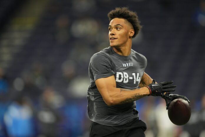 Christian Gonzalez participates in drills at Lucas Oil Stadium.