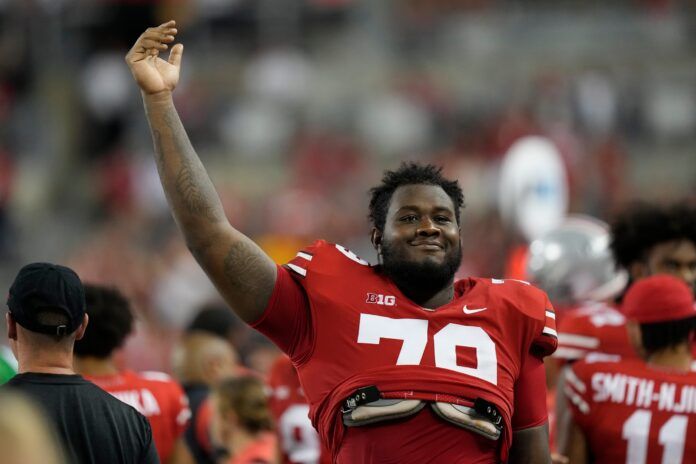 Ohio State Buckeyes offensive lineman Dawand Jones (79) celebrates following the 77-21 win over the Toledo Rockets in the NCAA Division I football game at Ohio Stadium.