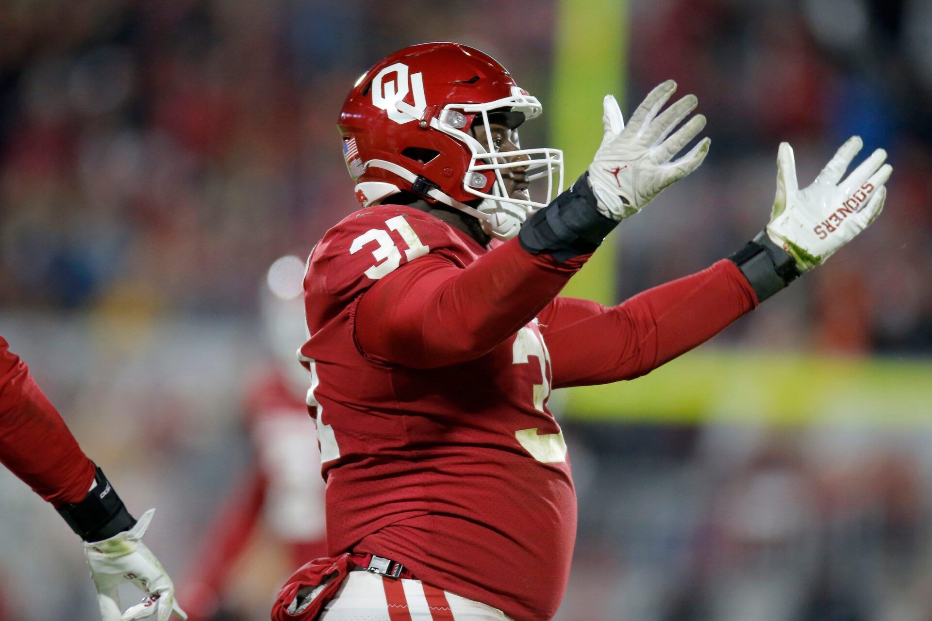 Oklahoma DT Jalen Redmond (31) celebrates after making a play.