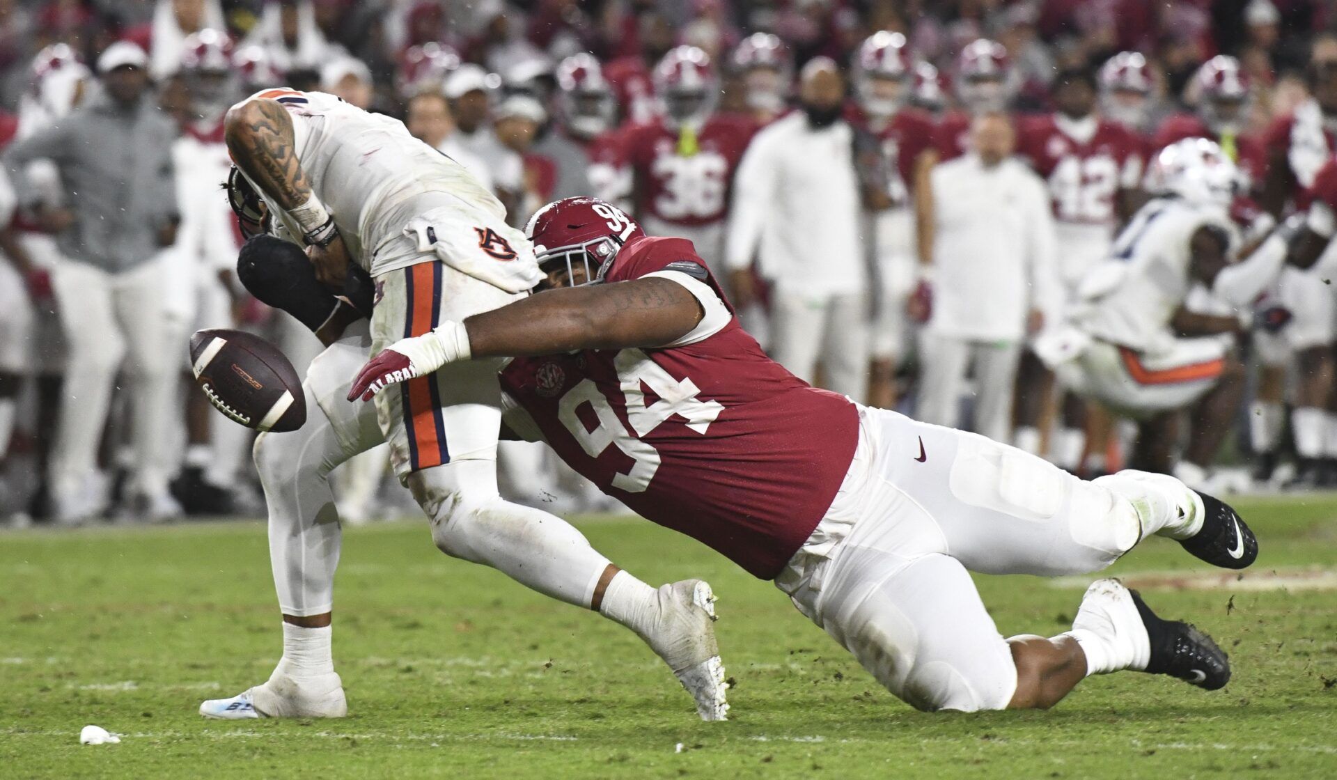 Alabama defensive tackle DJ Dale forces a fumble against Auburn QB Robby Ashford (9).