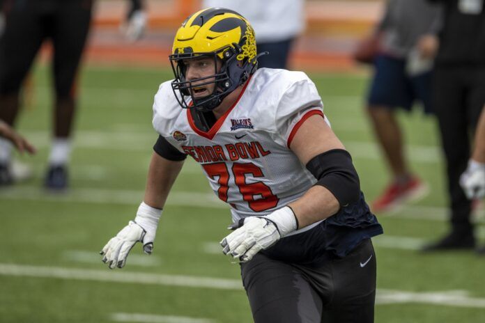 Michigan guard Ryan Hayes (76) running through practice at the Senior Bowl.