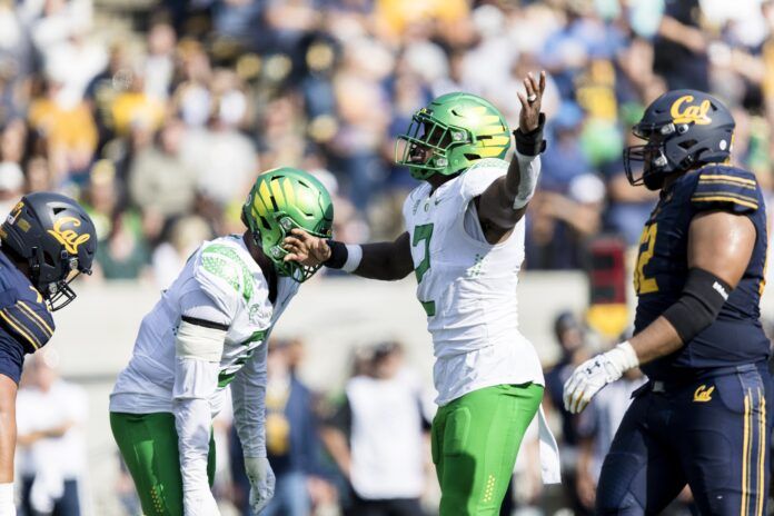 DJ Johnson celebrates after snacking California Golden Bears quarterback Jack Plummer.