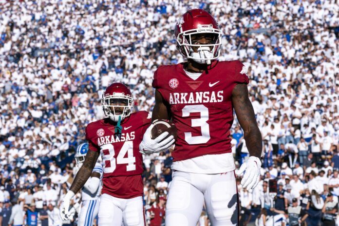 Matt Landers celebrates towards the crowd alongside wide receiver Warren Thompson after a touchdown.