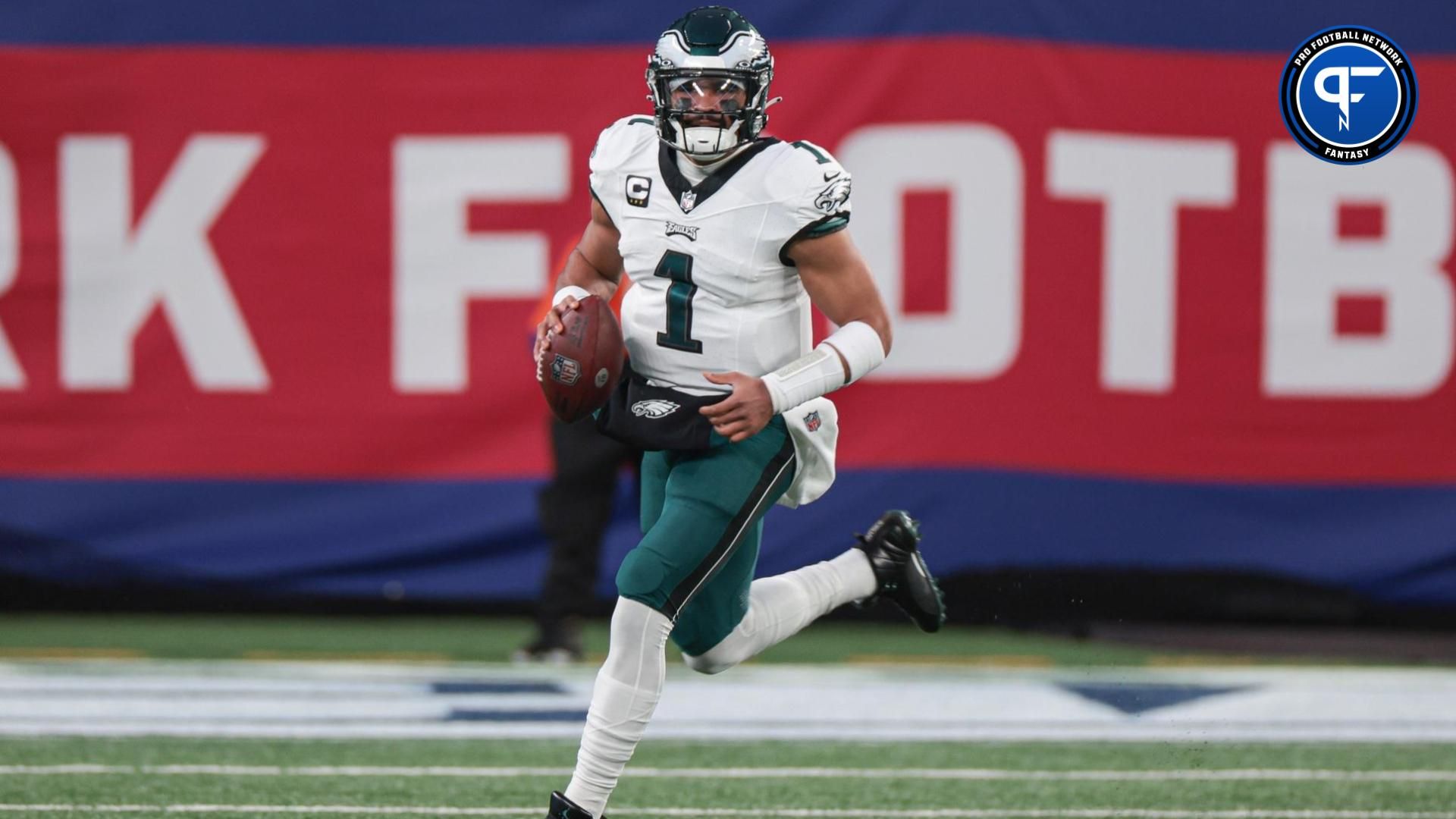 Philadelphia Eagles quarterback Jalen Hurts (1) scrambles against the New York Giants during the first quarter at MetLife Stadium.