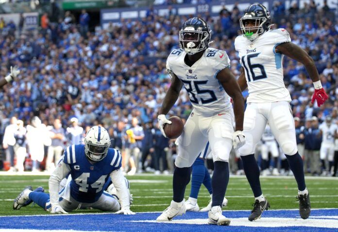 Chigoziem Okonkwo (85) celebrates after scoring a touchdown against the Indianapolis Colts during the first half at Lucas Oil Stadium.