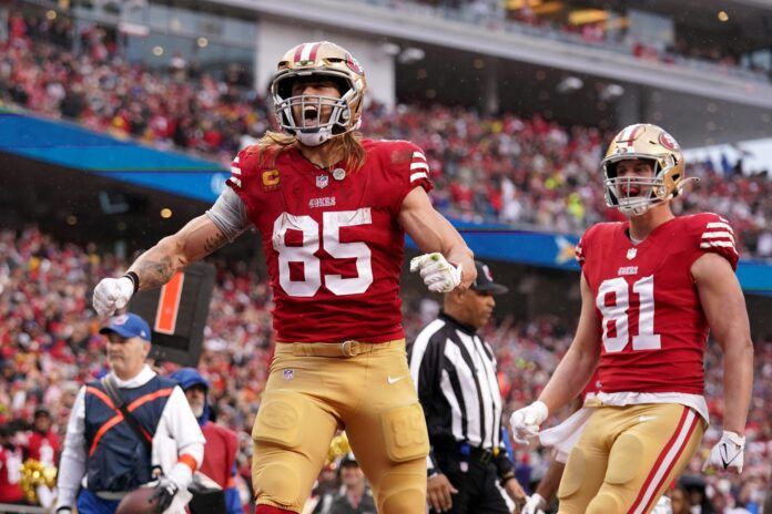 George Kittle (85) reacts after catching a pass for a two-point conversion in the third quarter of a Wild Card game against the Seattle Seahawks.