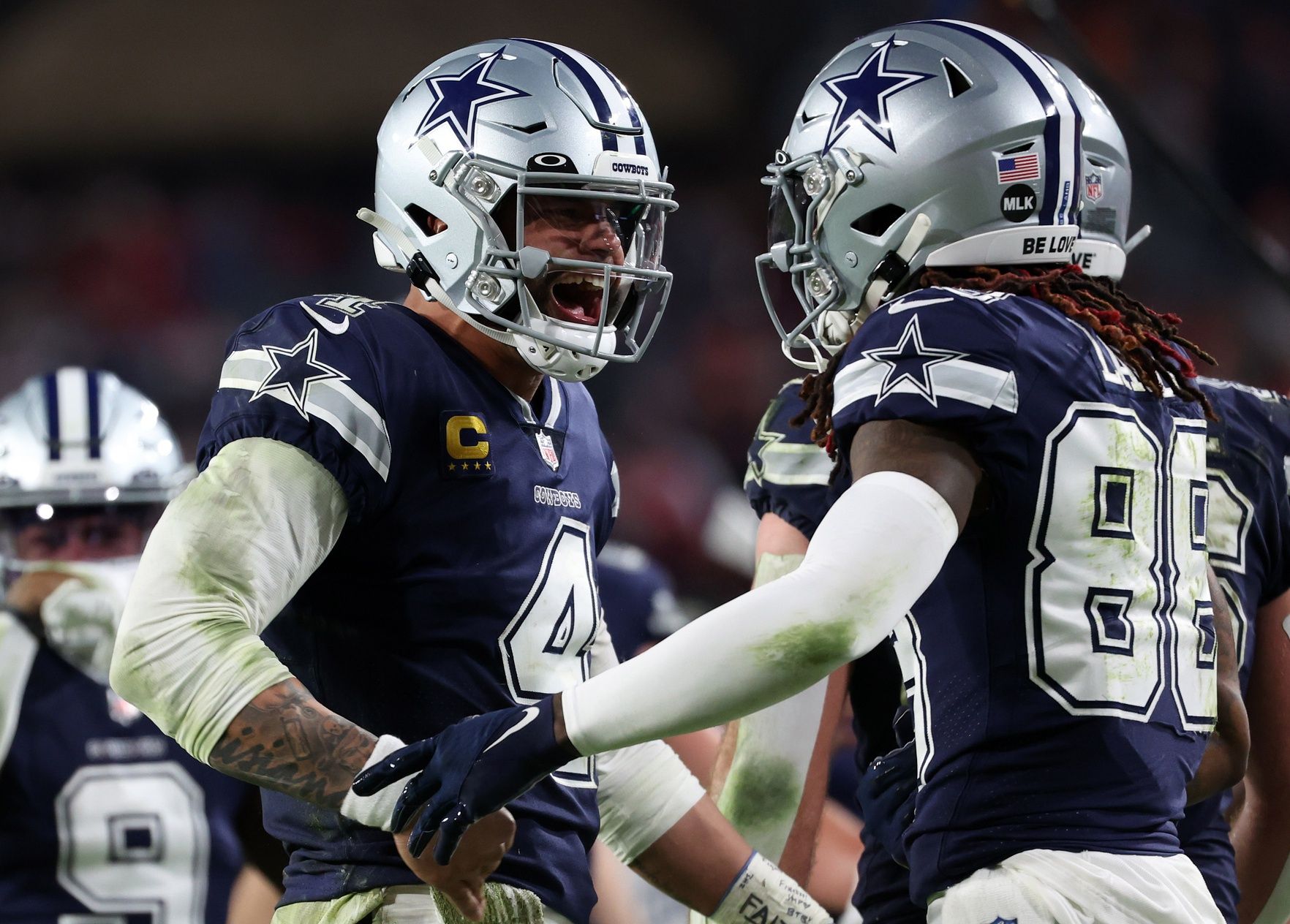 Dallas Cowboys quarterback Dak Prescott (4) reacts with wide receiver CeeDee Lamb (88).