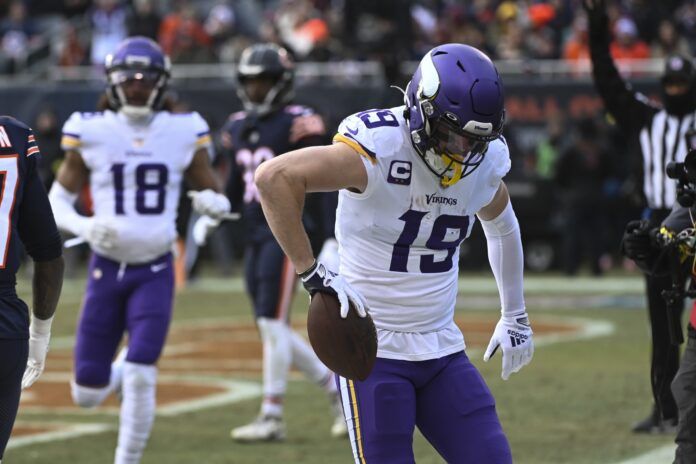 Adam Thielen (19) celebrates his touchdown against the Chicago Bears during the first half at Soldier Field.