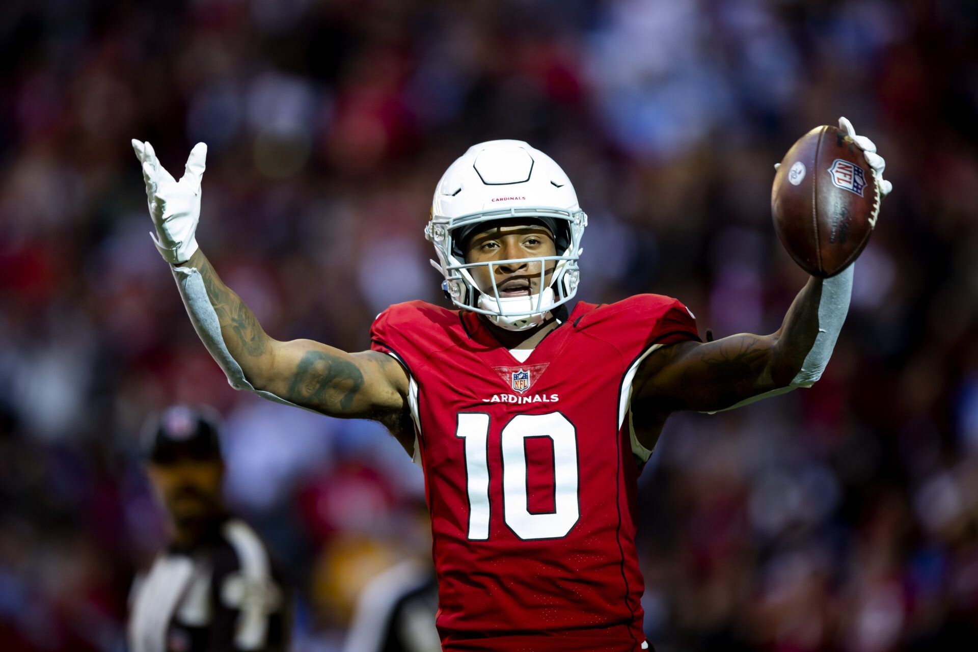 DeAndre Hopkins (10) celebrates a touchdown against the Los Angeles Chargers in the first half at State Farm Stadium.