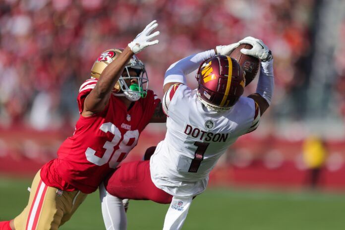 Washington Commanders WR Jahan Dotson (1) makes a catch against the San Francisco 49ers.