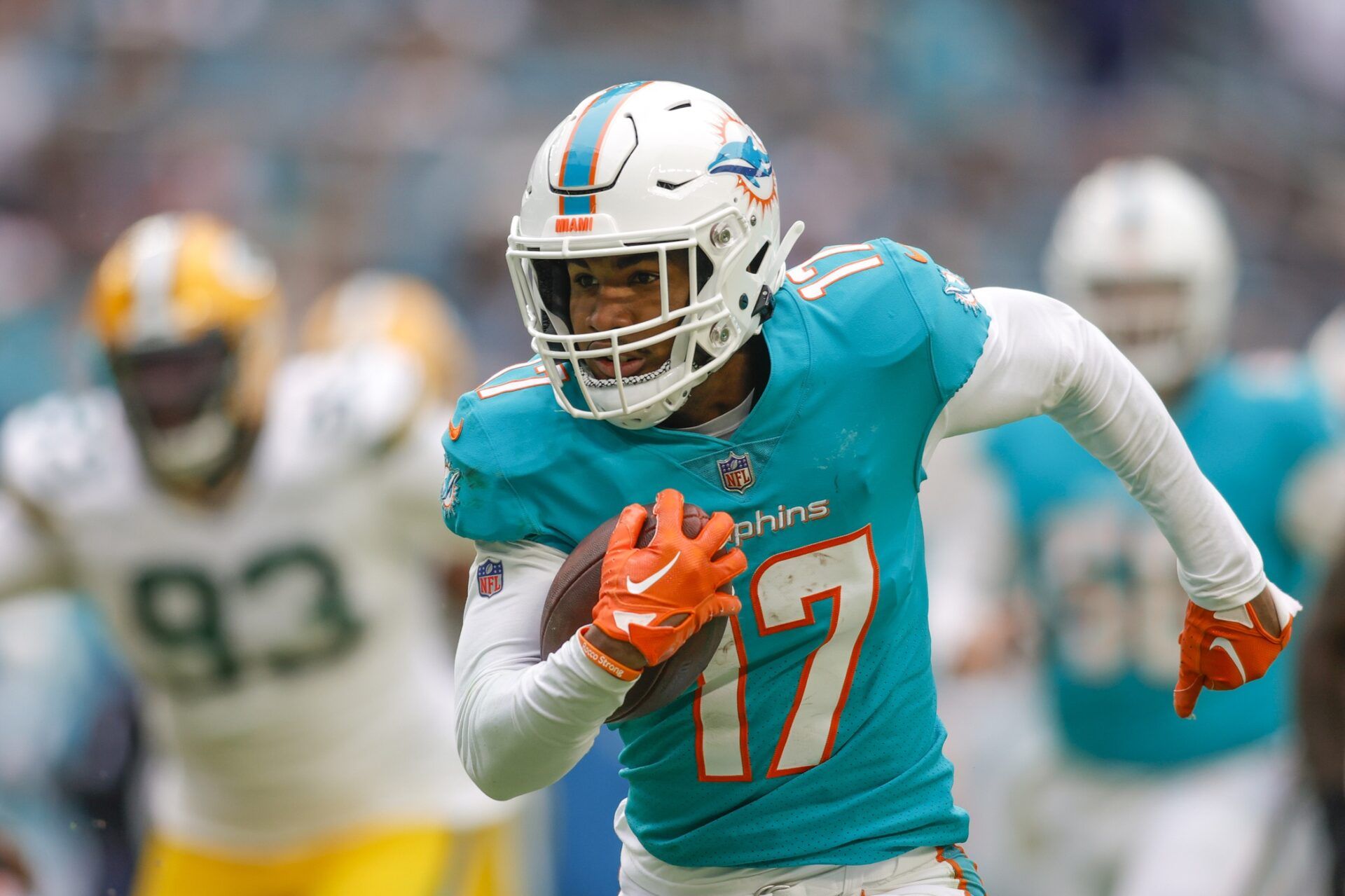 Jaylen Waddle (17) runs with the football during the fourth quarter against the Green Bay Packers at Hard Rock Stadium.