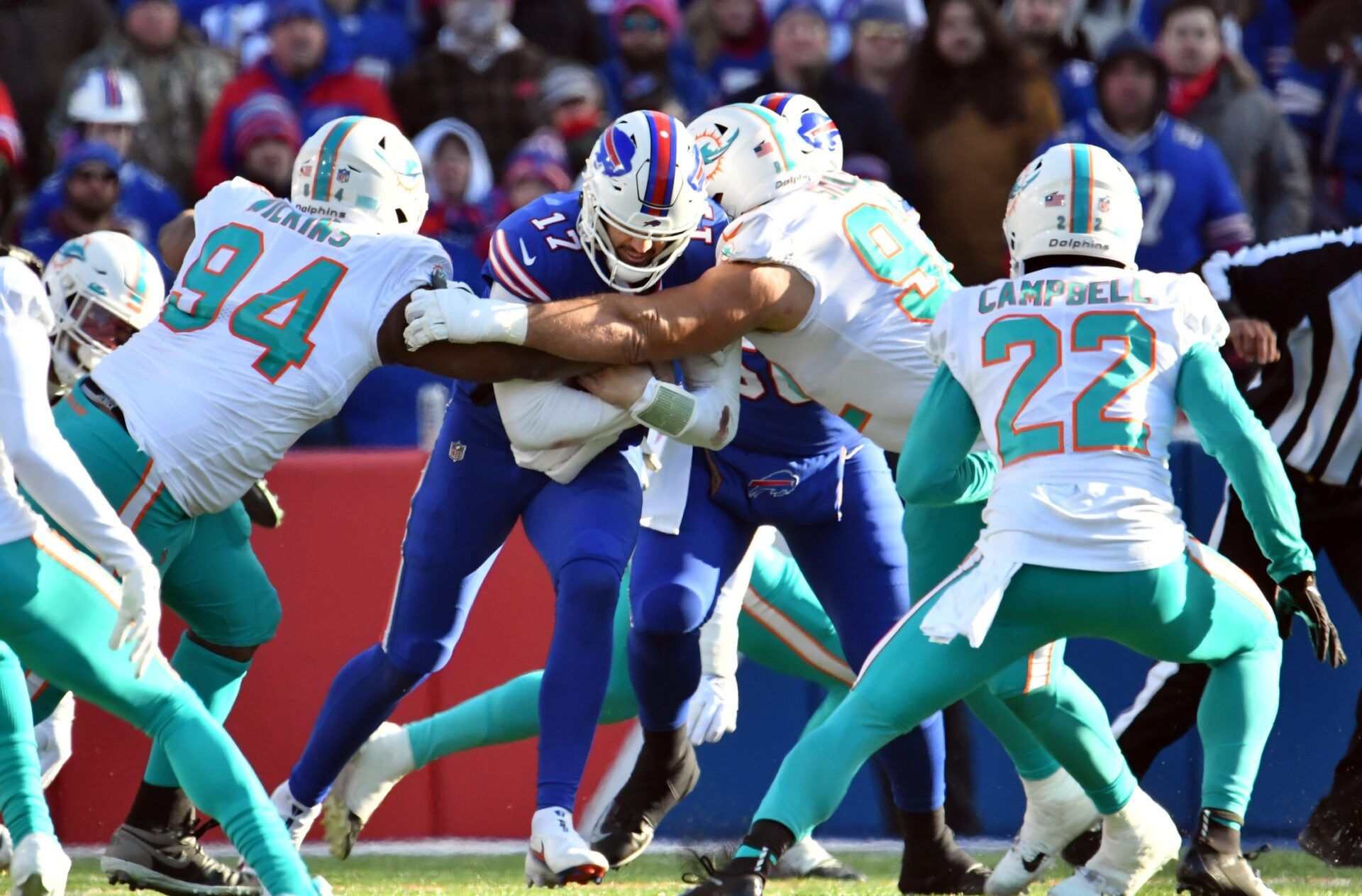 A group of Miami Dolphins defenders sack Buffalo Bills QB Josh Allen (17).